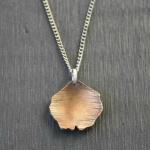Cherry Blossom Petal Necklace. Hand-cut, textured brass on sterling silver chain.