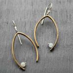 Balance Earrings Aquamarine. Hand forged brass with a subtle texture.  Sterling silver ear wires. Available in aquamarine and garnet. 
$65.00
