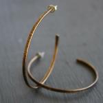 Large Birch Hoops. Textured brass hoops; hand-forged finished with a dark patina; sterling silver earpost. Hoops are approx. 52mm in diameter. $38.00