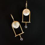 14k gold frames a luminous moon with a hinged pendulum. 
14k gold, reticulated silver and blue chalcedony. 
