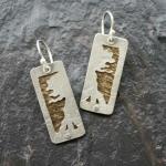 Mirrored Trees. 
Hand-cut and textured. Sterling silver and 14k gold-filled. 