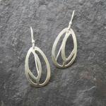 Lady Slippers
Hand-cut sterling silver earrings.
